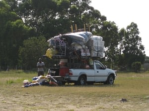 A car overloaded with furniture