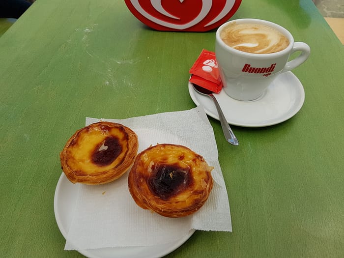 Coffee and two pasteis de natas